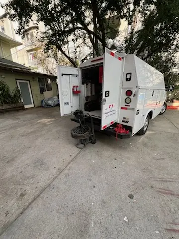 Magnet Plumbing service vehicle on-site for Grease Trap Cleaning in Yacht Club Estates